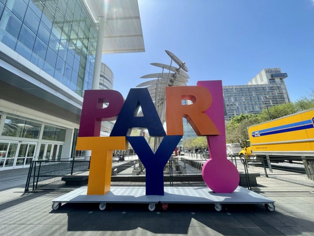 Large letter Party sign installed in front of a office building made by Smash Design.