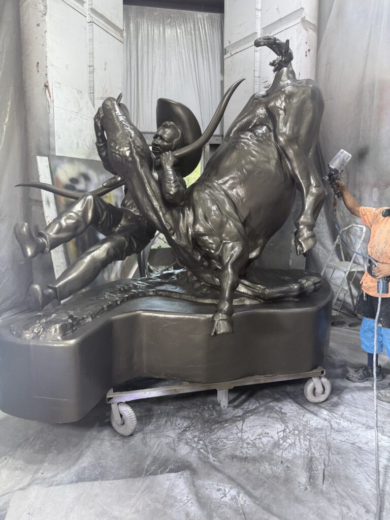 Smash Design staff painting a sculpture for the Sweet Tooth Rodeo brand activation