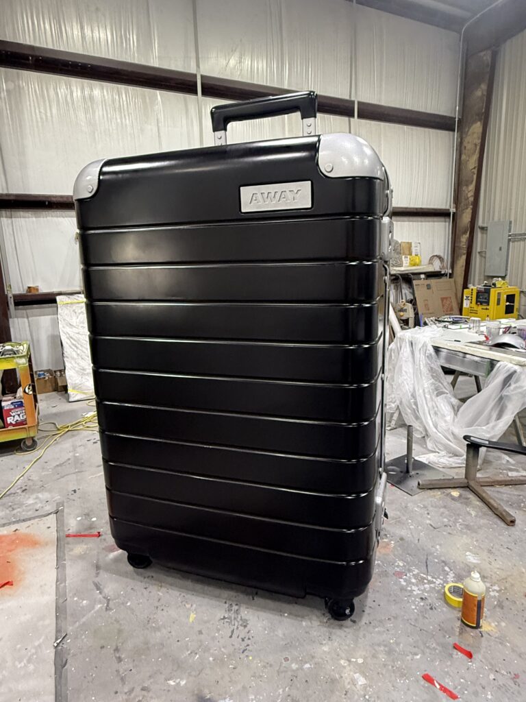 The 8-foot Away suitcase sculpture in Smash Design's Texas studio