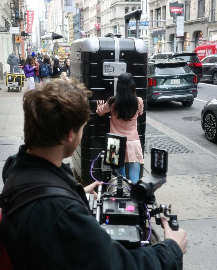 Commercial filming of Smash Design's 8-foot Away suitcase prop on the streets of NYC