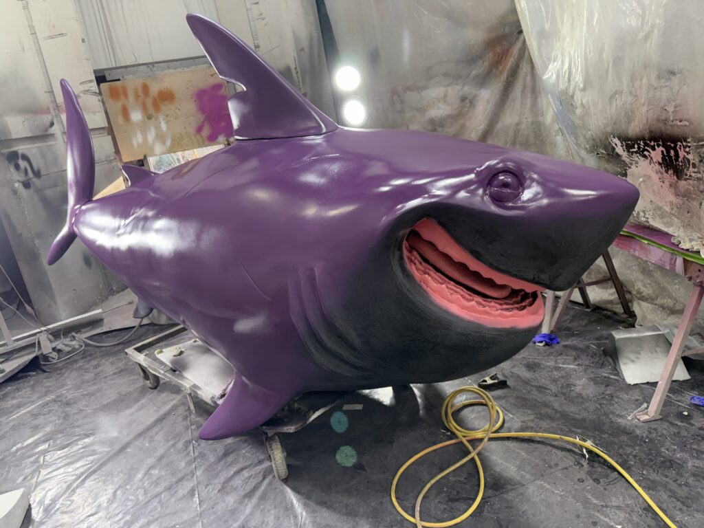 The foam sculpture of Diane Shark from the Pixar film Hoppers is finished with automotive paint in Smash Design Studios