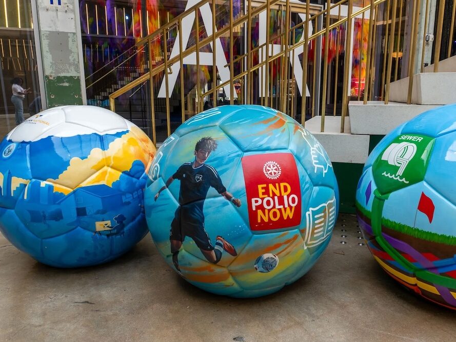 Giant, hand-painted soccer ball foam sculptures for FIFA World Cup 26 marketing popup