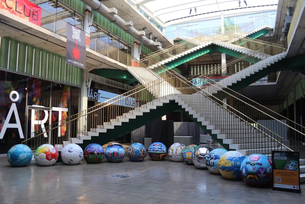 13 hand-painted soccer balls made by foam sculptor Smash Design for FIFA World Cup 26 Houston popup marketing events