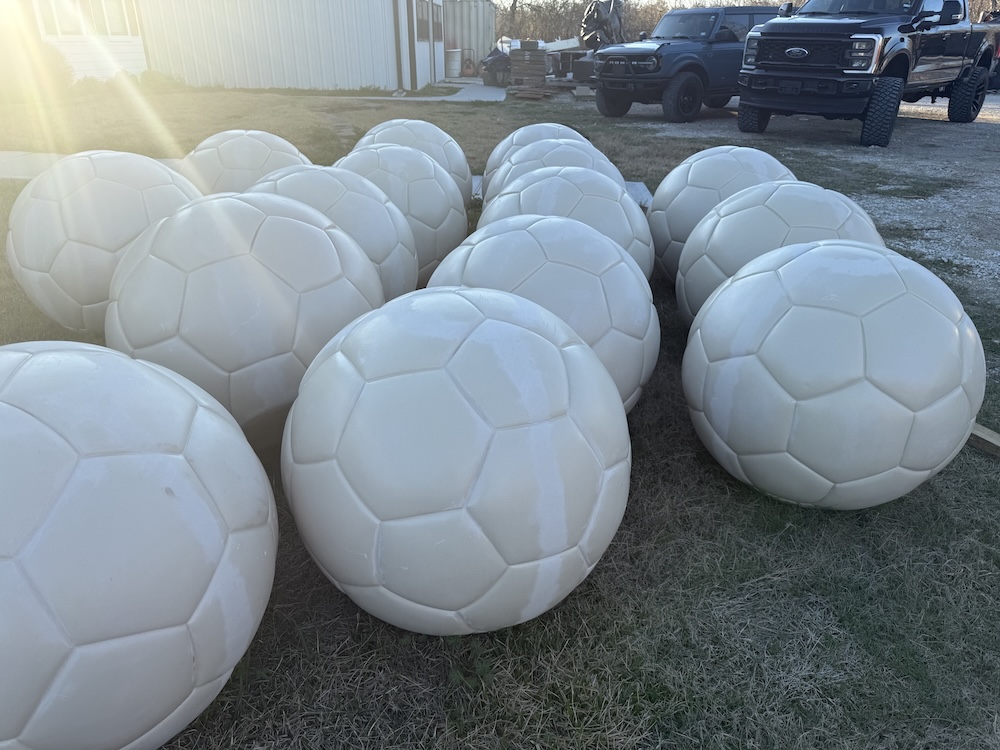 Large foam sculptures of soccer balls for immersive marketing pop-up