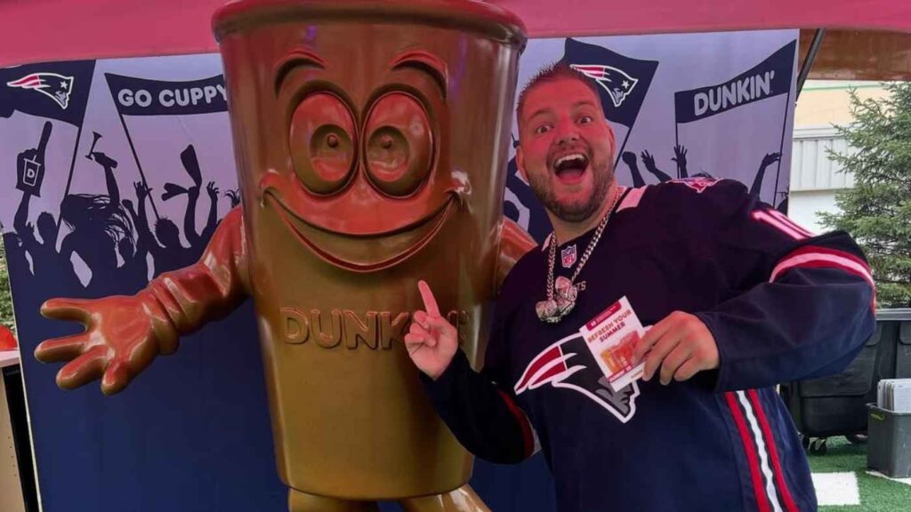 An NFL fan points at a foam sculpture created for brand pop-ups by Smash Design